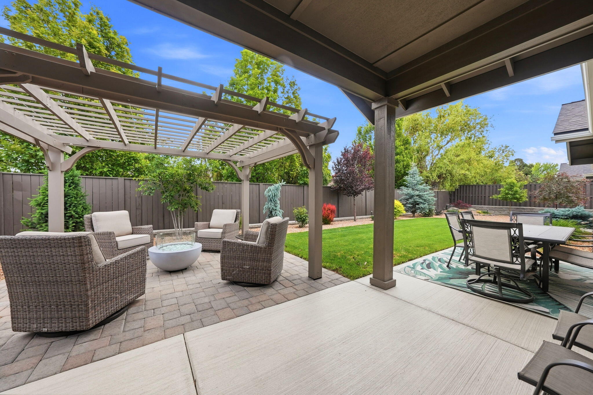 2714 Northwest 23rd Street Redmond, OR 97756 - Photo 35 of 57 a view of a patio with couches chairs and a table and chairs