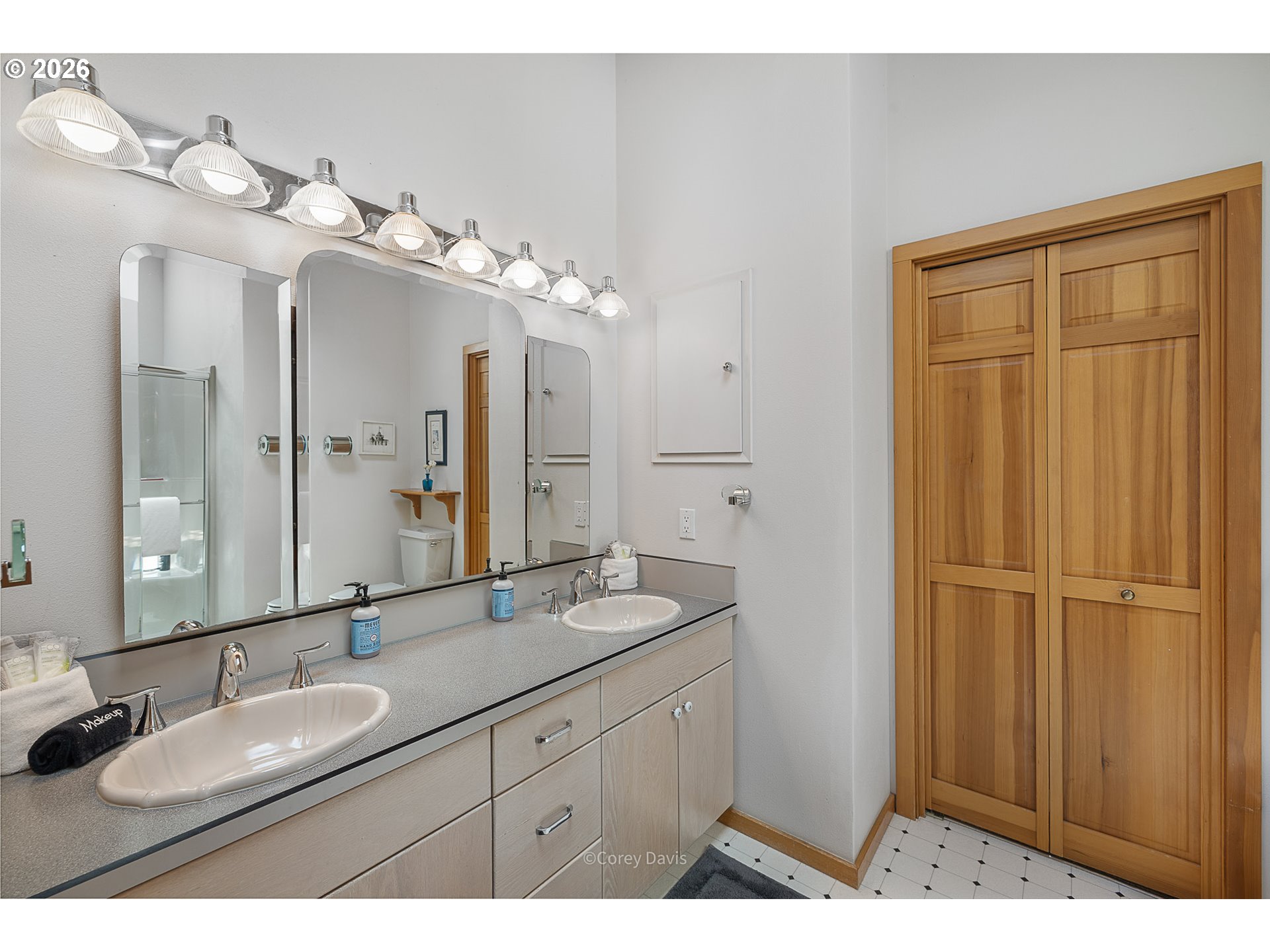 38295 Beulah Reed Road Nehalem, OR 97131 - Photo 35 of 42 a bathroom with a double vanity sink and a mirror