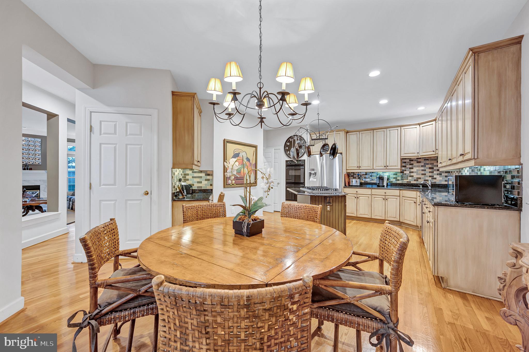 10918 Bells Ridge Drive Potomac, MD 20854 - Photo 17 of 41 a view of a dining room with furniture and wooden floor