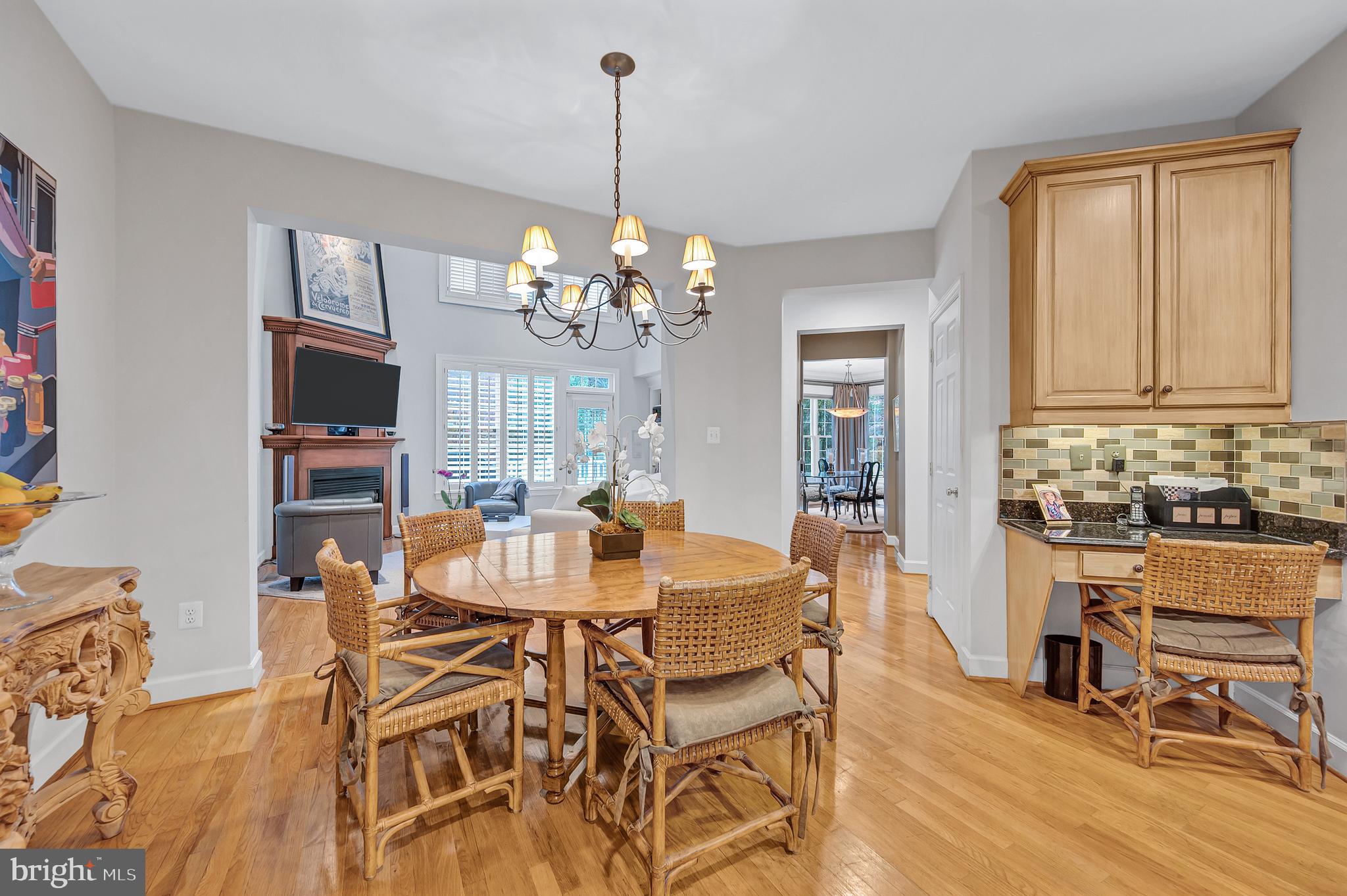 10918 Bells Ridge Drive Potomac, MD 20854 - Photo 18 of 41 a view of a dining room with furniture and wooden floor