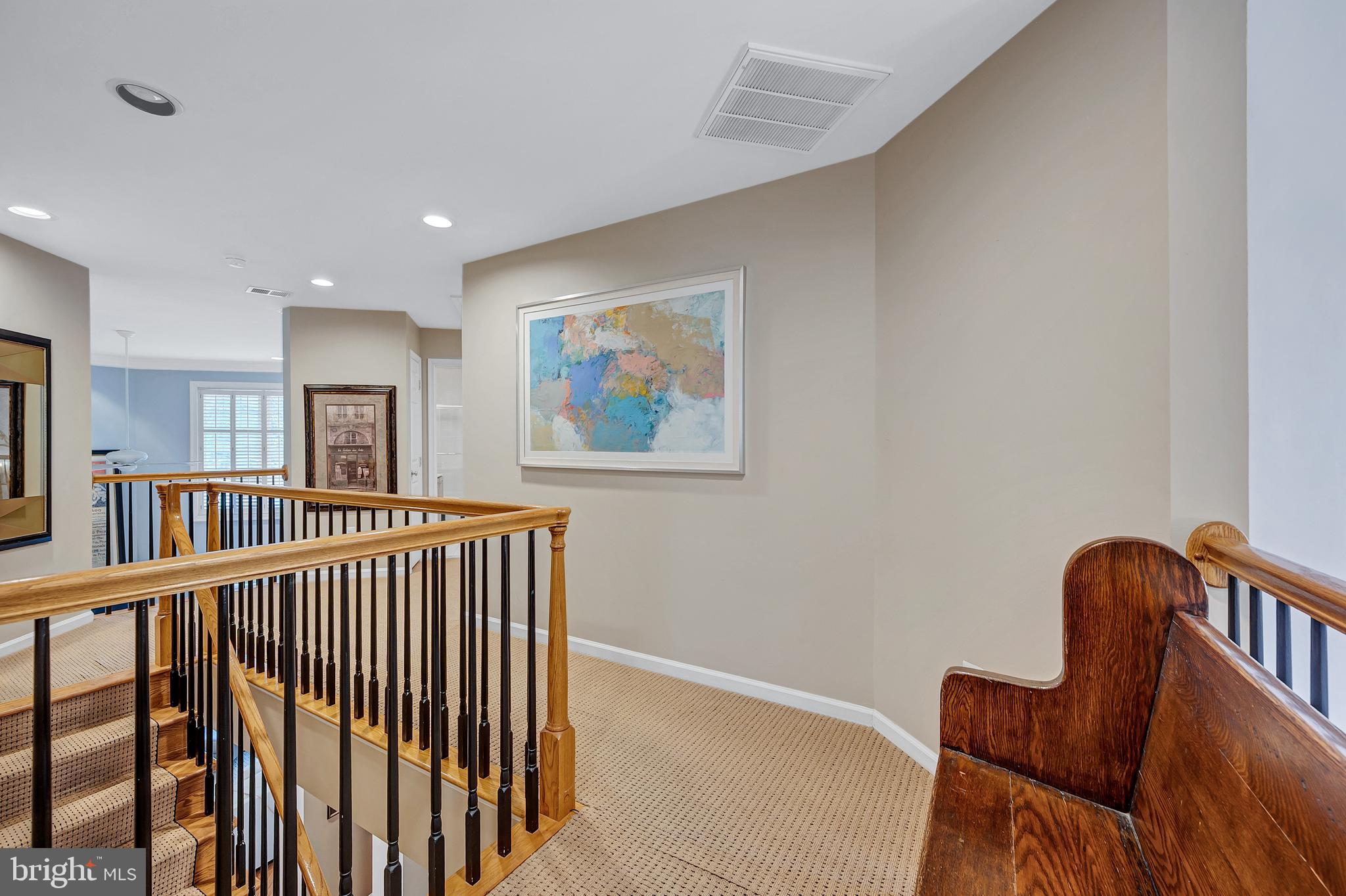 10918 Bells Ridge Drive Potomac, MD 20854 - Photo 31 of 41 a view of a hallway with wooden floor and furniture
