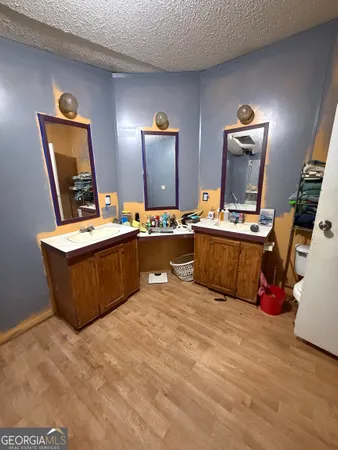 a room with a wooden floor and furniture