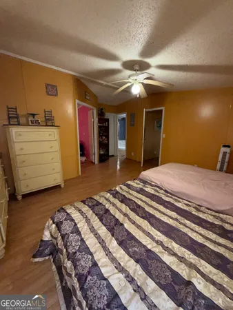 a bedroom with a bed and cabinets
