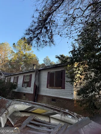 a house with trees in the background