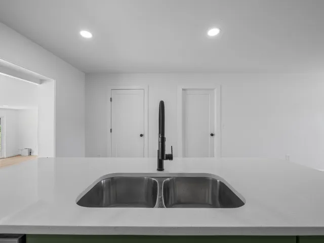 a bathroom with a sink and mirror
