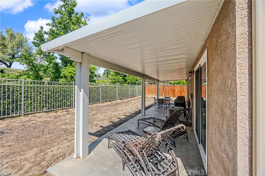 43121 Corte Cabrera Temecula, CA 92592 - Photo 12 of 17 a bed room with a bed and a wooden floor