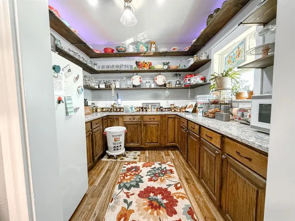 a kitchen with stainless steel appliances granite countertop a sink and cabinets