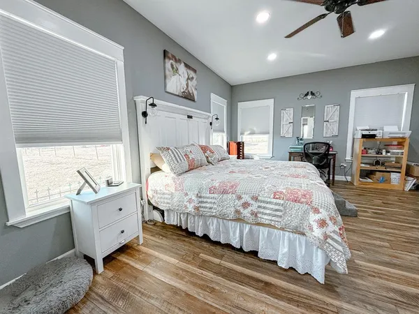 a bedroom with a bed and a window