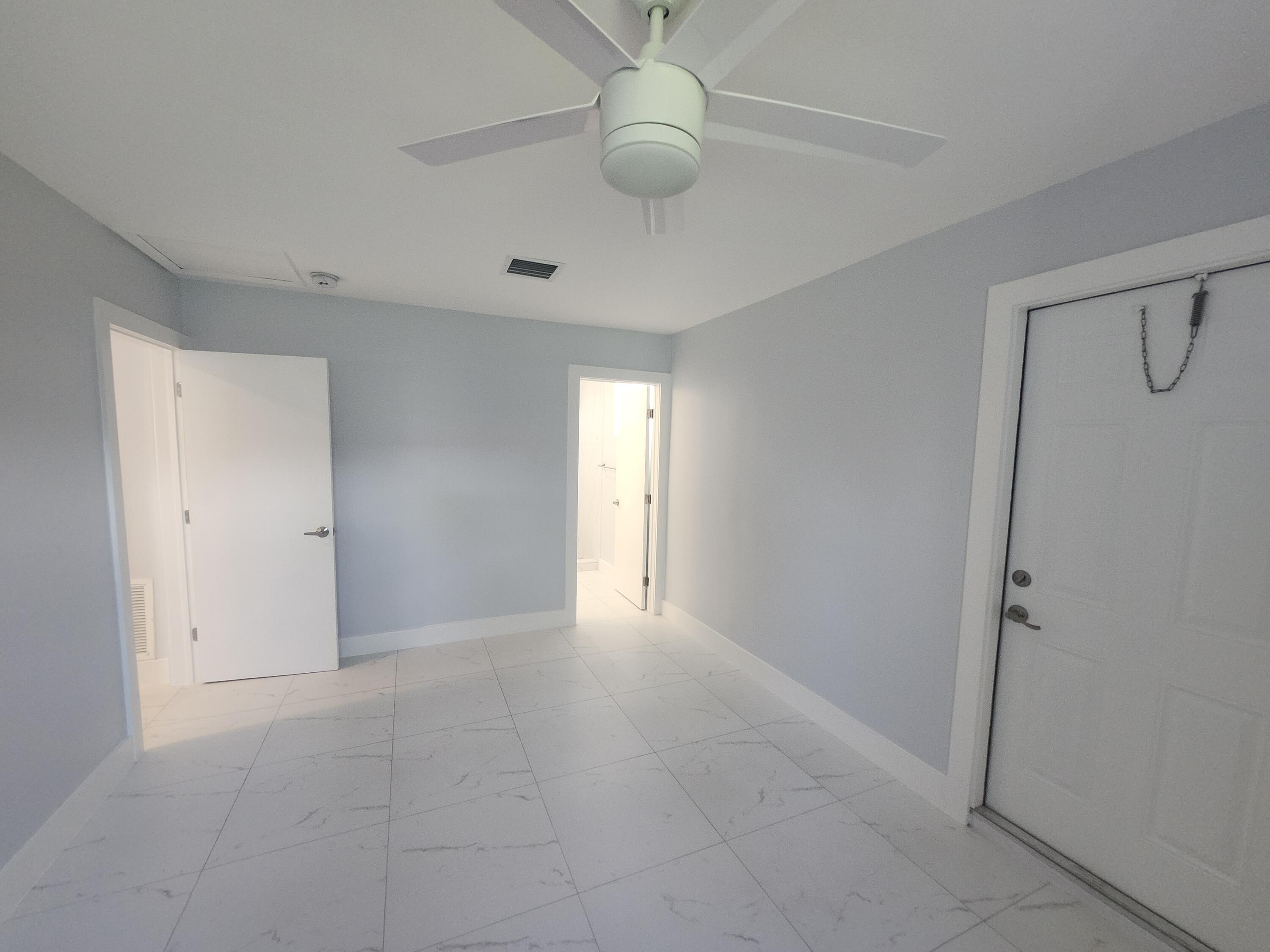 511 Northwest 60th Way, Unit EAST APARTMENT Hollywood, FL 33024 - Photo 11 of 15 a view of an empty room with a window