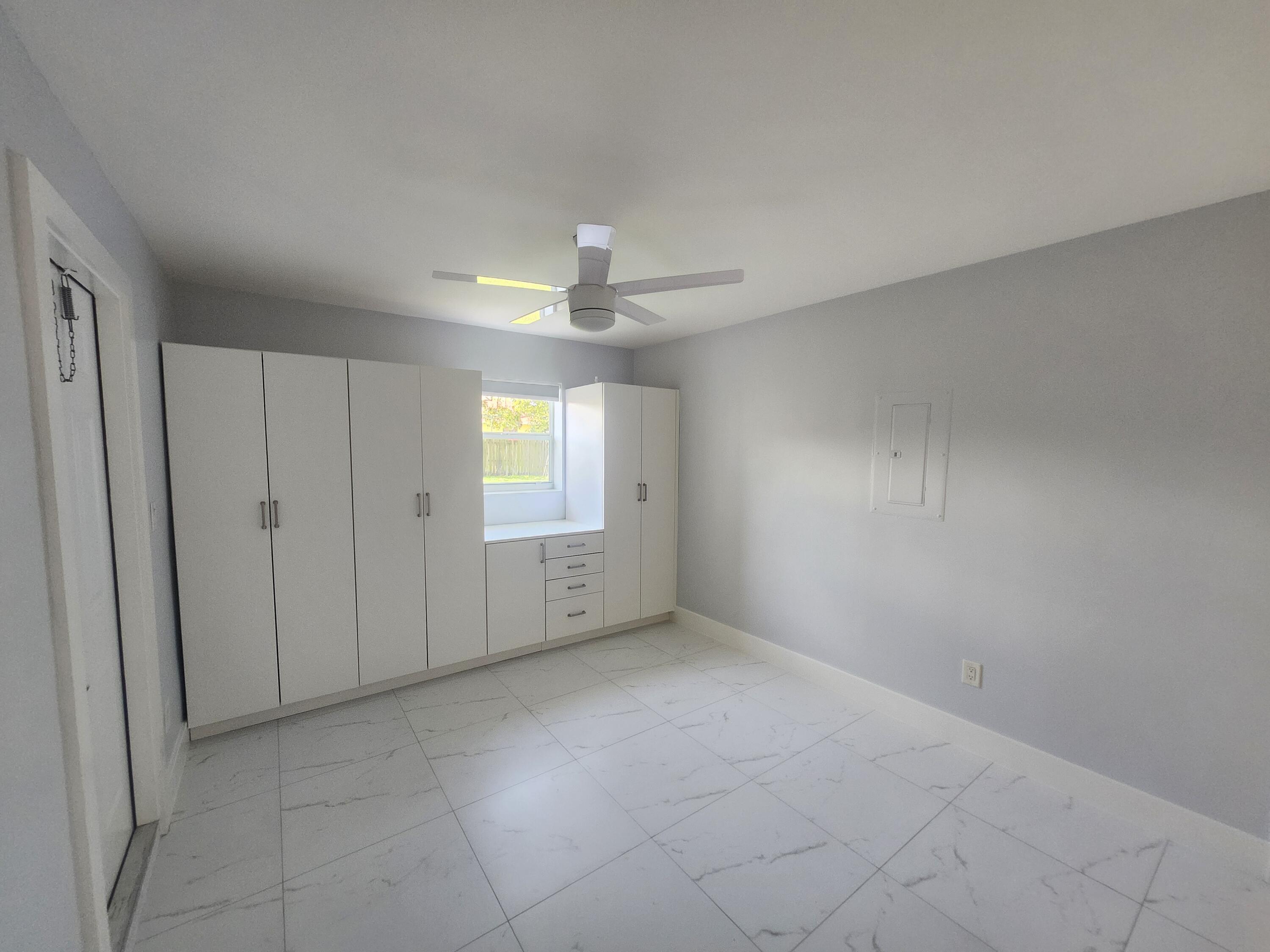 511 Northwest 60th Way, Unit EAST APARTMENT Hollywood, FL 33024 - Photo 10 of 15 a view of an empty room with a window