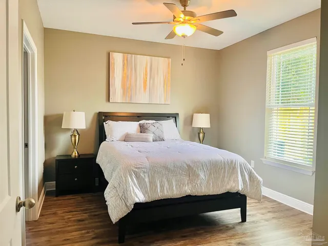 a bedroom with a bed and window