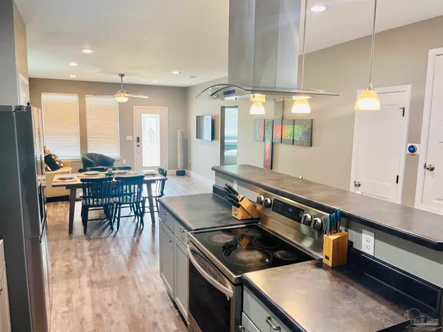 a kitchen with a table chairs and a sink