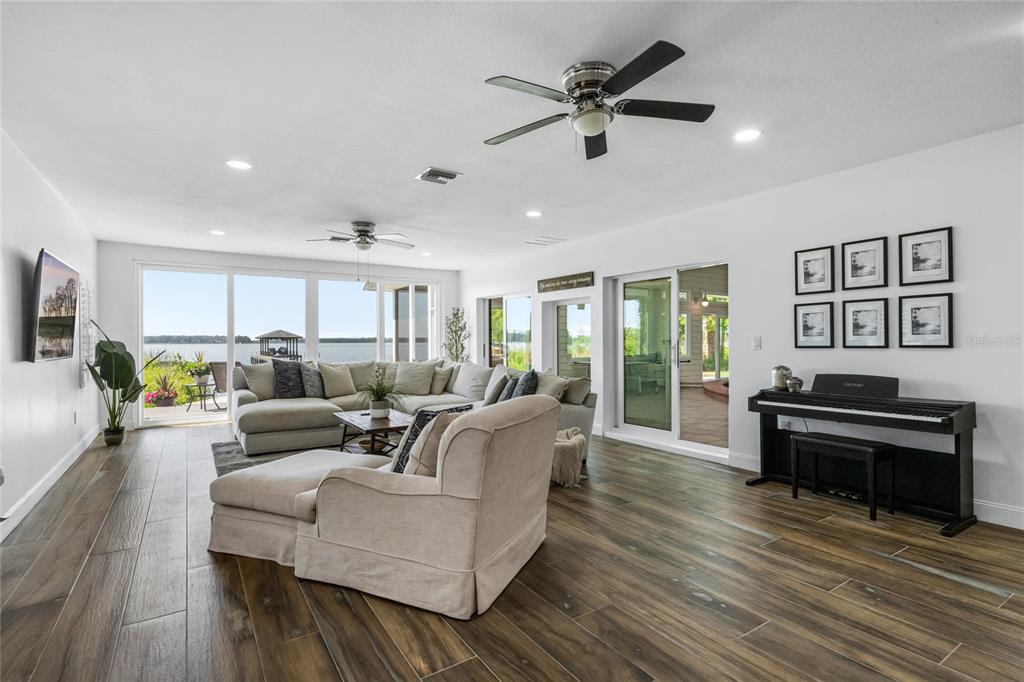13830 Lake Mary Jane Road Orlando, FL 32832 - Photo 23 of 99 a living room with furniture and a wooden floor