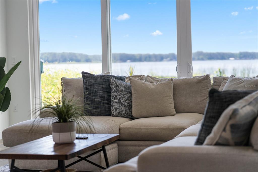 13830 Lake Mary Jane Road Orlando, FL 32832 - Photo 25 of 99 a living room with furniture potted plant and a large window