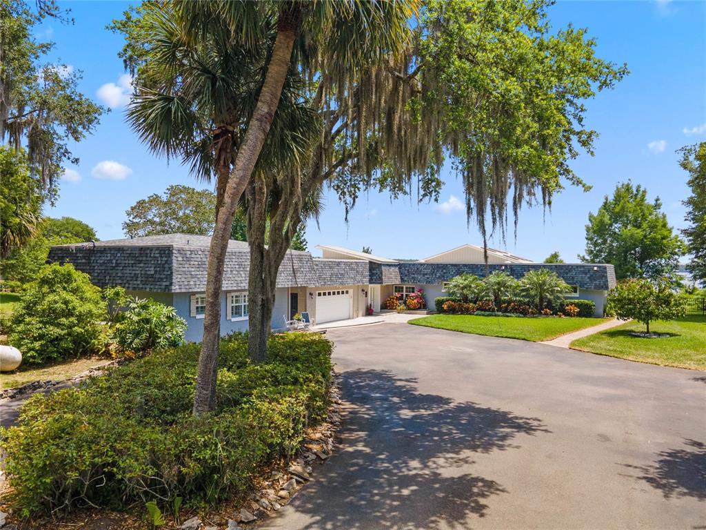 13830 Lake Mary Jane Road Orlando, FL 32832 - Photo 6 of 99 a view of a backyard with palm trees