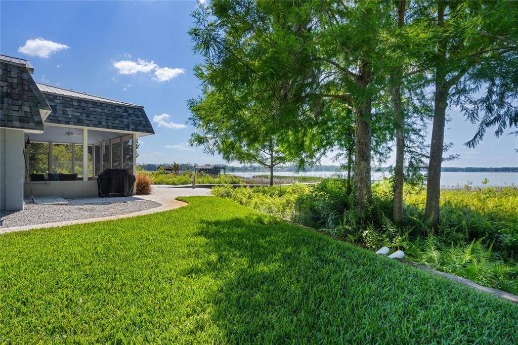 13830 Lake Mary Jane Road Orlando, FL 32832 - Photo 70 of 99 a view of a house with pool and a garden