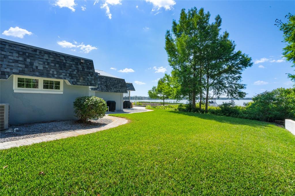 13830 Lake Mary Jane Road Orlando, FL 32832 - Photo 71 of 99 a view of a house with a backyard