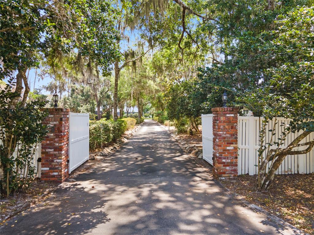 13830 Lake Mary Jane Road Orlando, FL 32832 - Photo 73 of 99 a view of a street with large trees