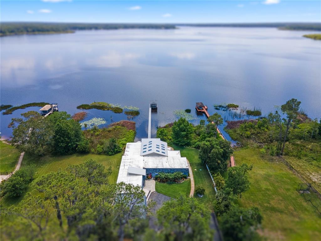13830 Lake Mary Jane Road Orlando, FL 32832 - Photo 83 of 99 a backyard of a house with a yard and outdoor seating