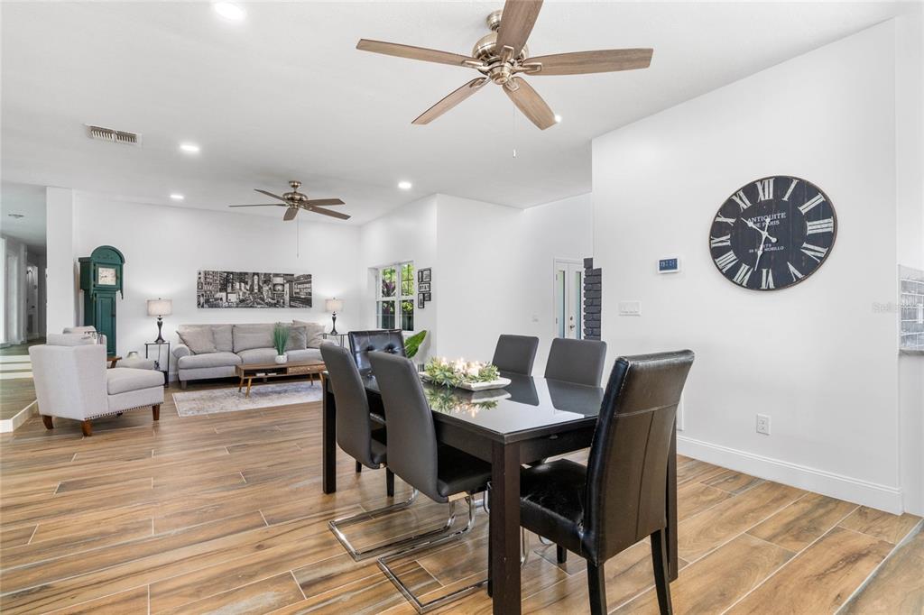 13830 Lake Mary Jane Road Orlando, FL 32832 - Photo 10 of 99 a view of a dining room with furniture wooden floor