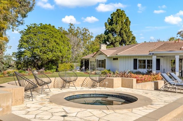 a front view of a house with swimming pool