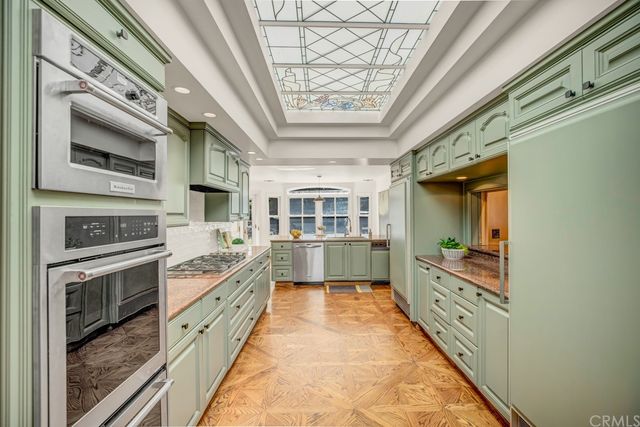 a large kitchen with a stove and a dishwasher