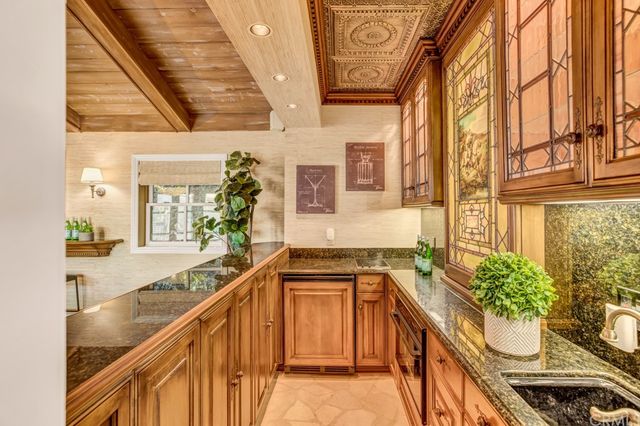 a bedroom with a bed and painting on the wall