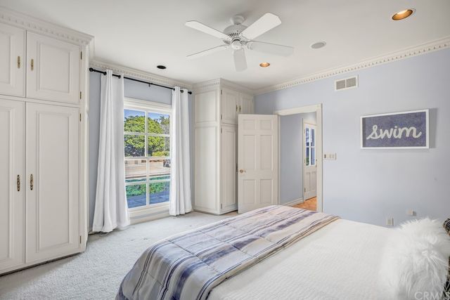 an aerial view of a house with a lake view