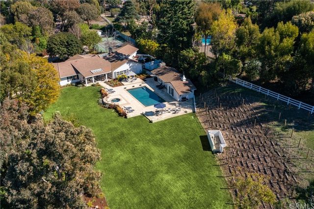 an aerial view of residential house with outdoor space