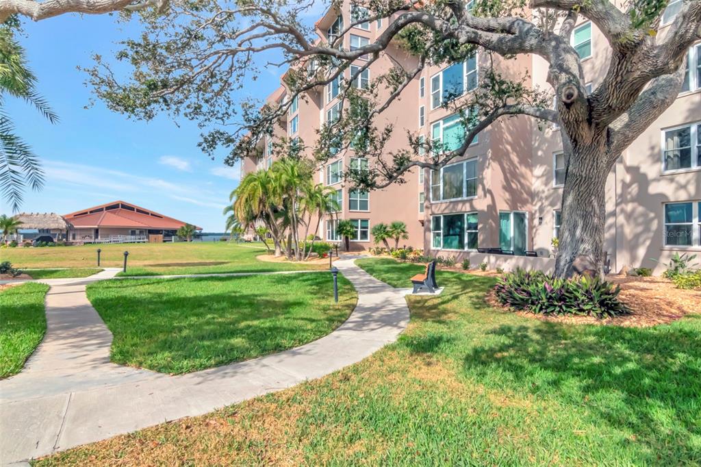 634 Edgewater Drive, Unit 848 Dunedin, FL 34698 - Photo 16 of 40 a view of a garden with swimming pool