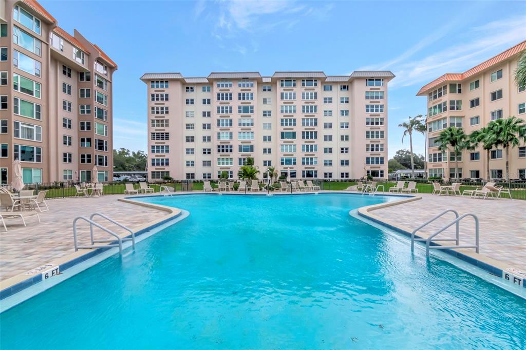 634 Edgewater Drive, Unit 848 Dunedin, FL 34698 - Photo 18 of 40 a view of a building with a garden