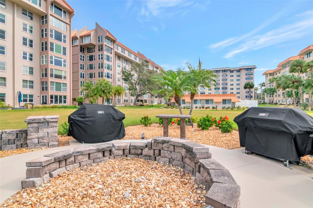 634 Edgewater Drive, Unit 848 Dunedin, FL 34698 - Photo 22 of 40 a building outdoor space with patio furniture and potted plants