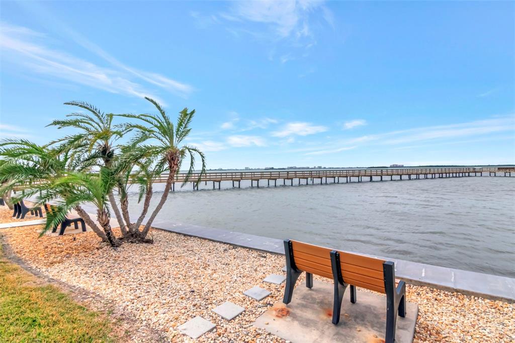 634 Edgewater Drive, Unit 848 Dunedin, FL 34698 - Photo 23 of 40 a view of a lake with outdoor space