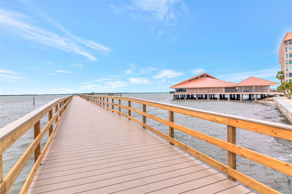 634 Edgewater Drive, Unit 848 Dunedin, FL 34698 - Photo 24 of 40 a view of balcony and deck with wooden floor