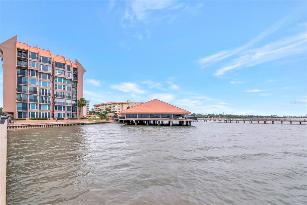 634 Edgewater Drive, Unit 848 Dunedin, FL 34698 - Photo 33 of 40 a view of a lake with a city skyline in the background
