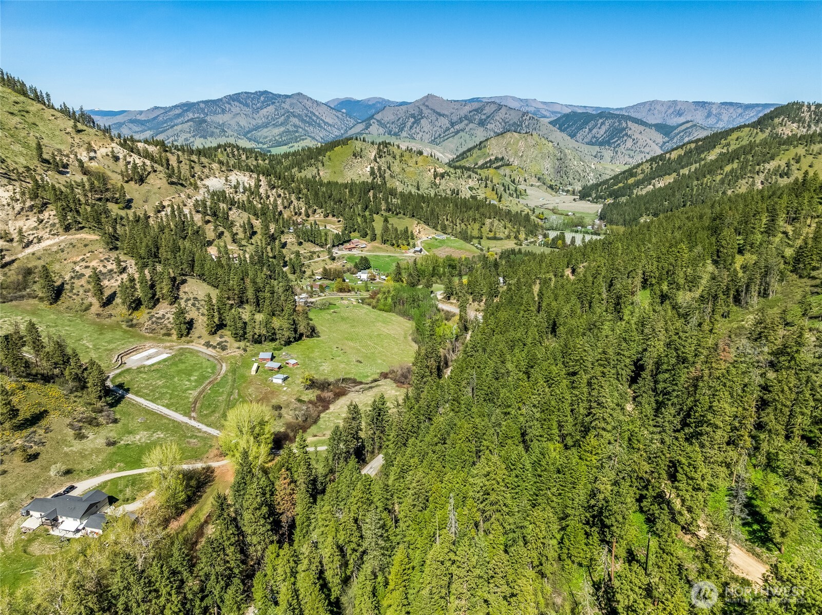 8325 Taber Road Cashmere, WA 98815 - Photo 11 of 13 a view of a lush green hillside and houses