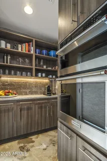 a kitchen with granite countertop a stove and a sink