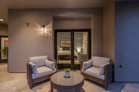 a bedroom with a bed and a large mirror