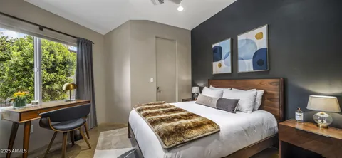 a view of walk in closet and kitchen