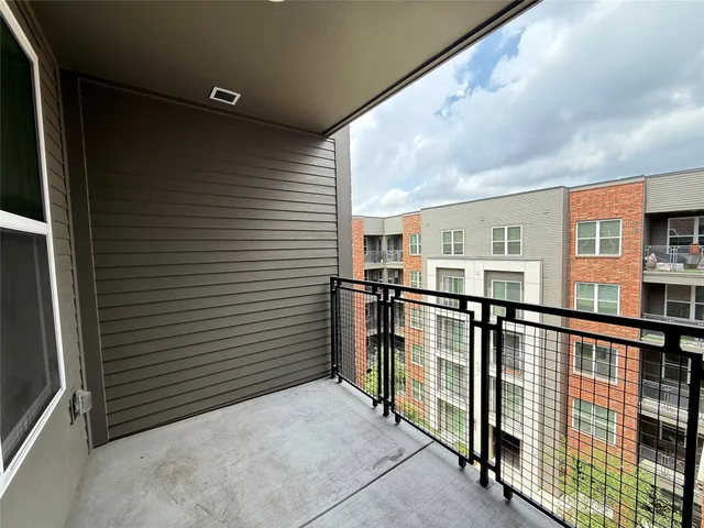 a view of a balcony with chairs