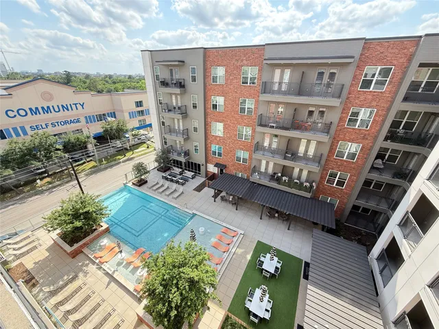 a view of multiple houses with a yard