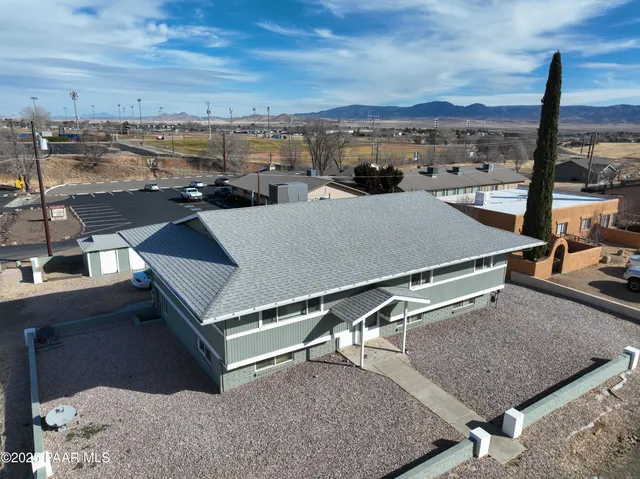 a view of a terrace with chairs and a table