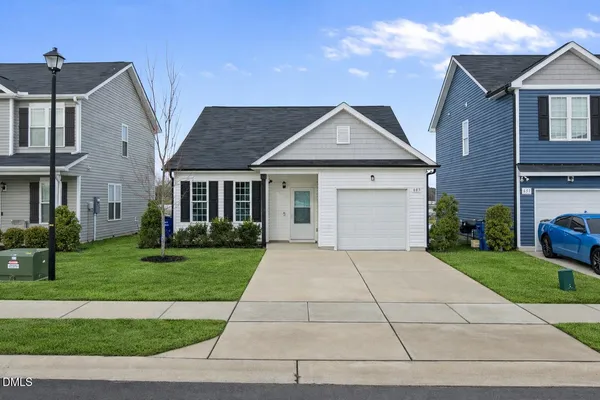 a front view of a house with a yard