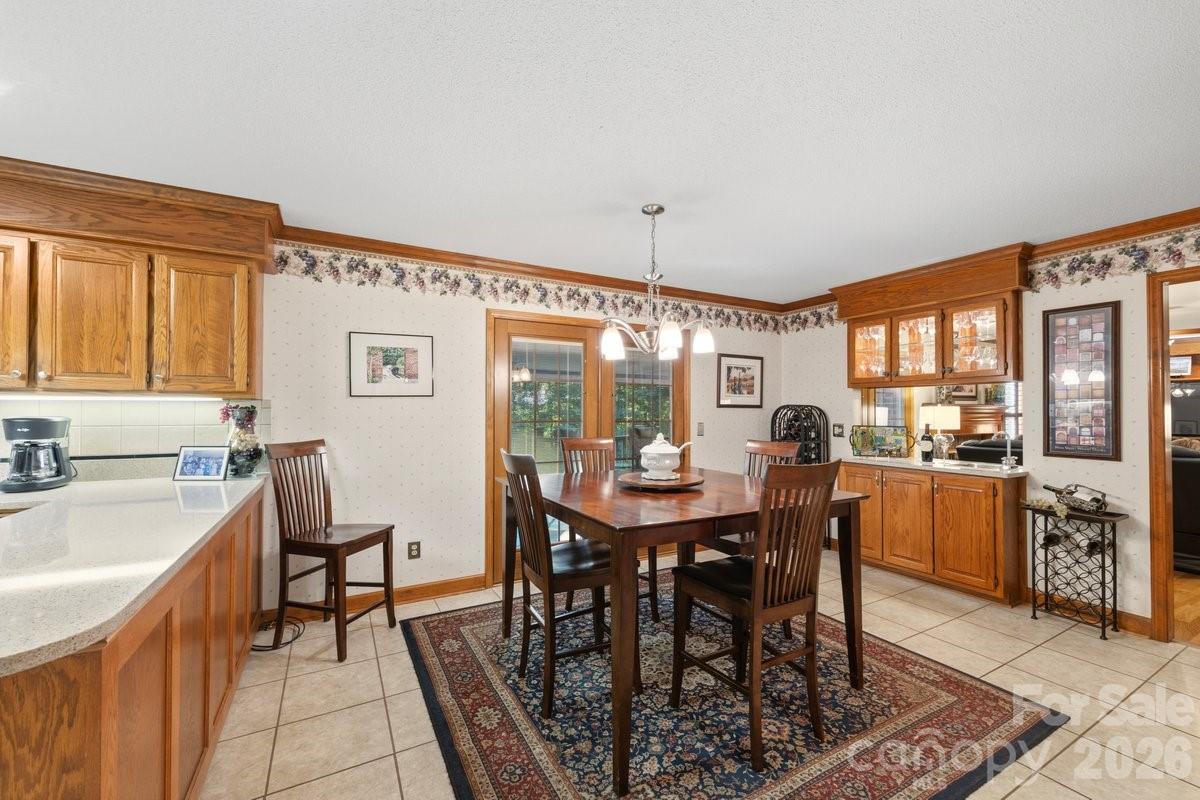 207 Lost Corner Road Morganton, NC 28655 - Photo 17 of 46 a view of a dining room with furniture and chandelier