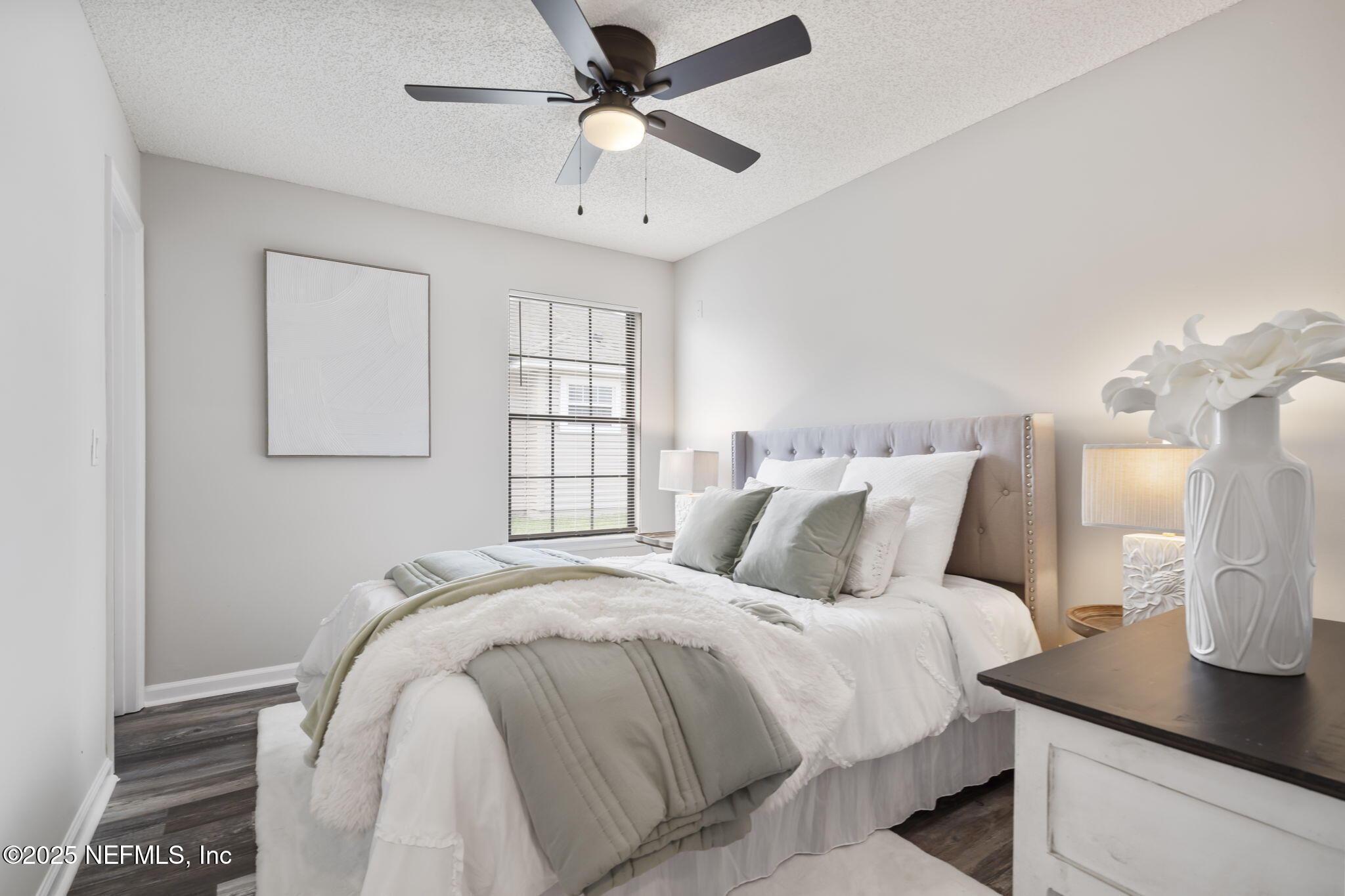 2987 Quapaw Trail Middleburg, FL 32068 - Photo 15 of 32 a bedroom with a bed and a table in it