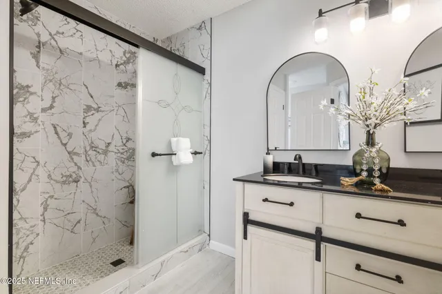 a close view of two sink and a mirror