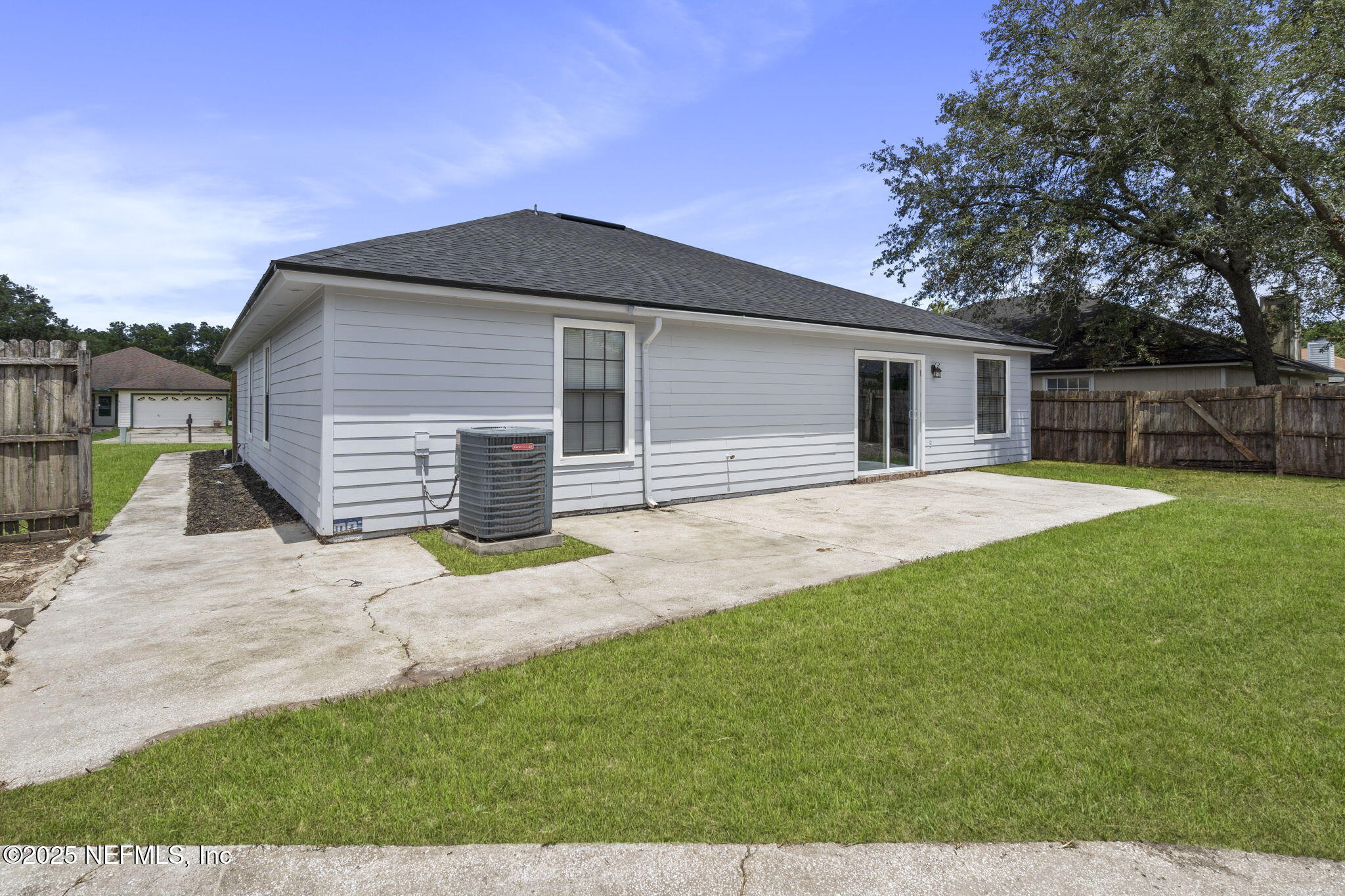 2987 Quapaw Trail Middleburg, FL 32068 - Photo 30 of 32 a front view of a house with a yard and garage