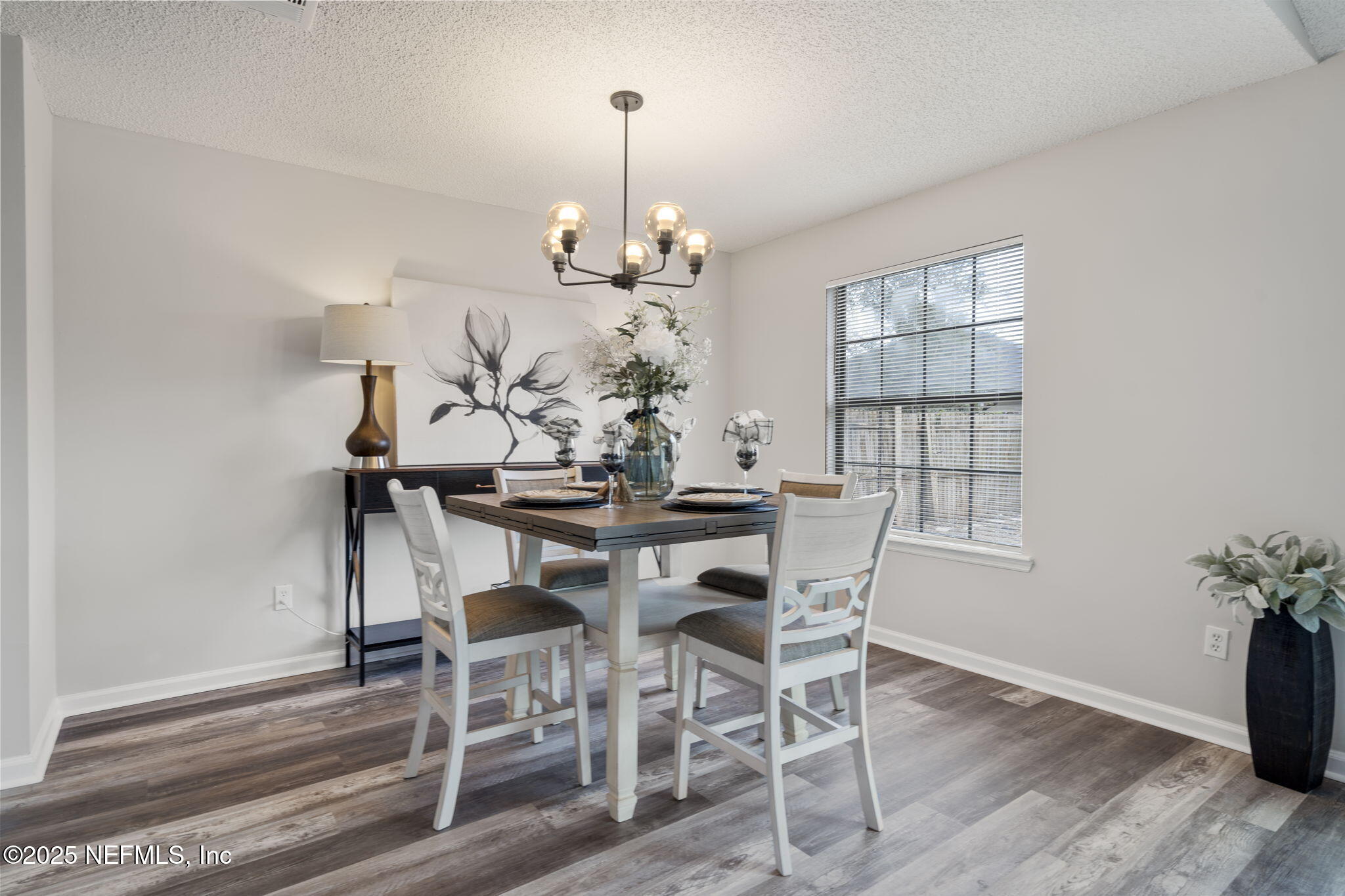 2987 Quapaw Trail Middleburg, FL 32068 - Photo 10 of 32 a view of a dining room with furniture and wooden floor