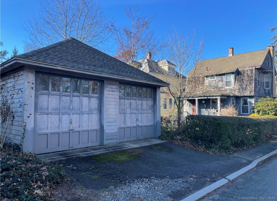 178 Elm Street Meriden, CT 06450 - Photo 13 of 18 a front view of a house with garden