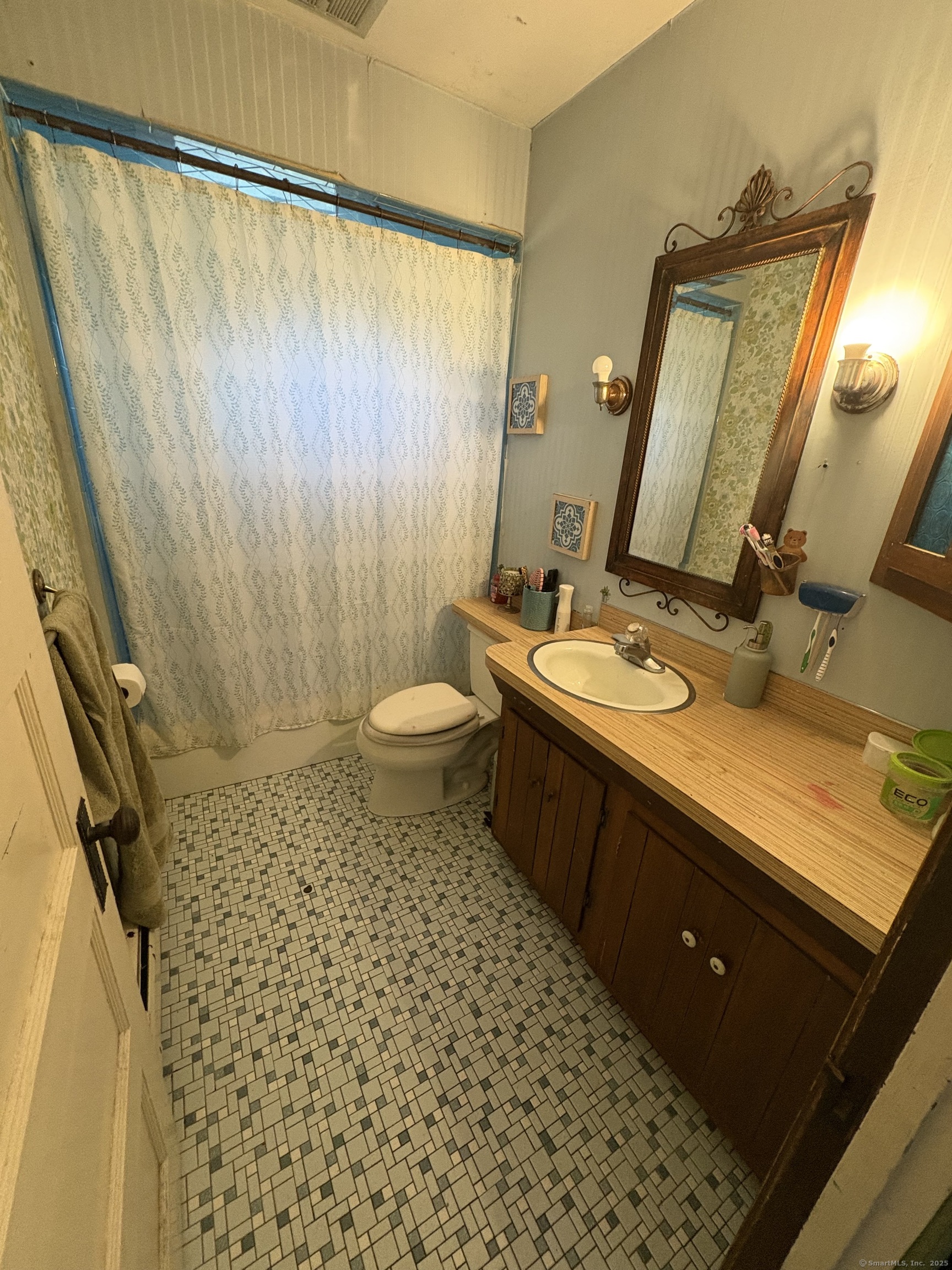 178 Elm Street Meriden, CT 06450 - Photo 15 of 18 a bathroom with a sink a toilet a mirror and shower